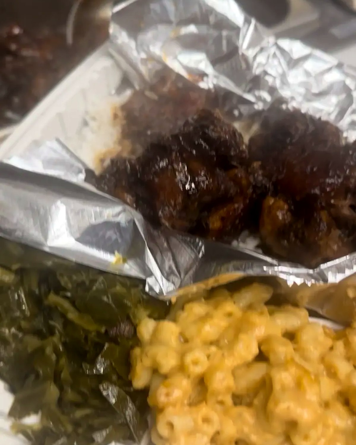 Slow-cooked collard greens with macaroni and cheese and barbecue rib tips