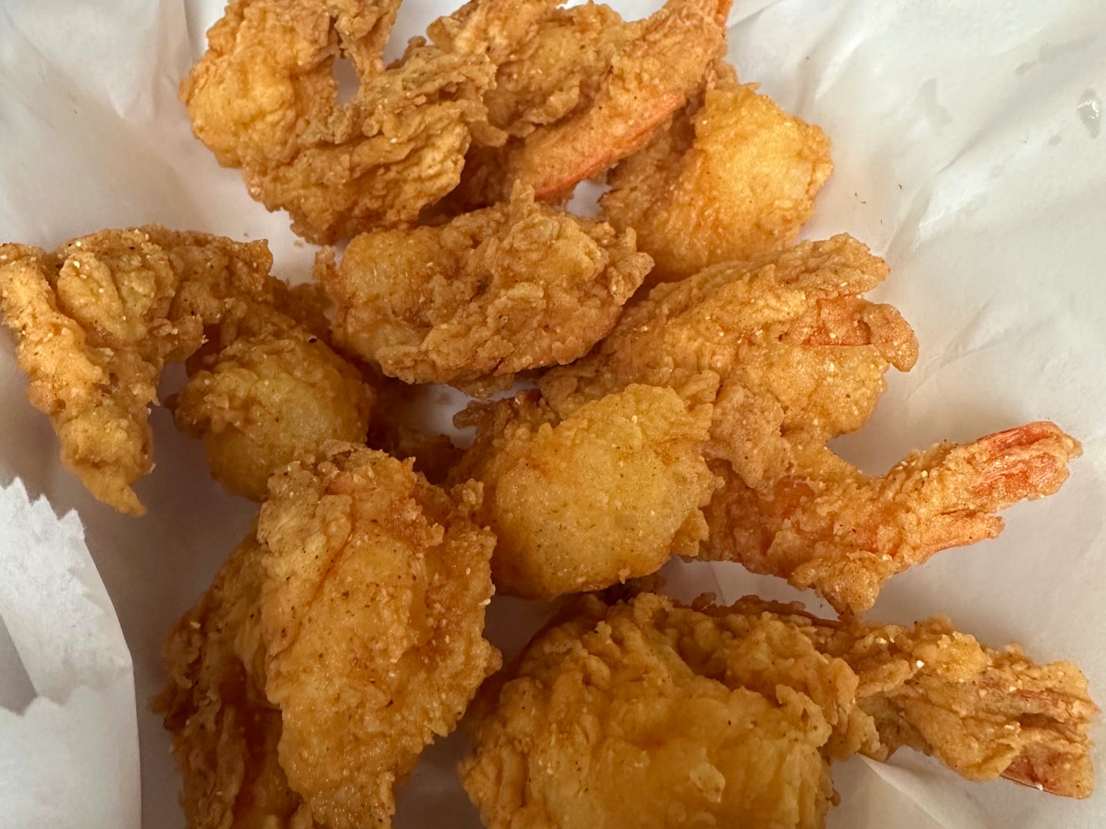 Golden hand-battered fried shrimp served hot